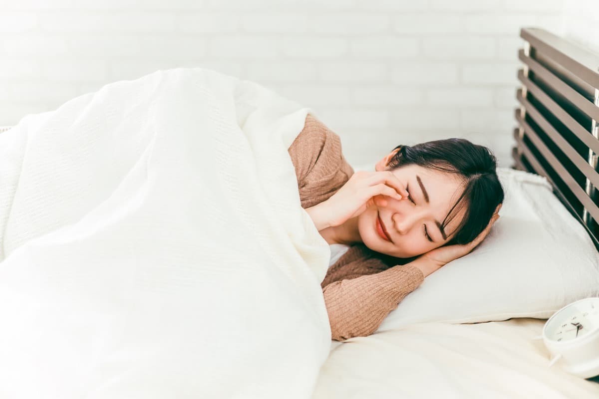 体調不良の女性